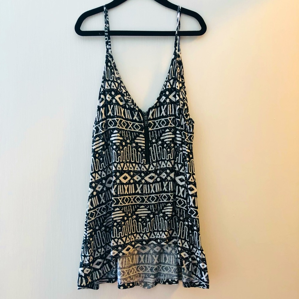 Aztec inspired print tank. Unique zipper detail on front. Flowy style.